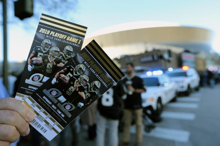 Jan 5, 2020; New Orleans, Louisiana, USA; A fan holds tickets outside the Mercedes-Benz Superdome before an NFC Wild Card playoff football game between the New Orleans Saints and the Minnesota Vikings. Mandatory Credit: Chuck Cook -USA TODAY Sports